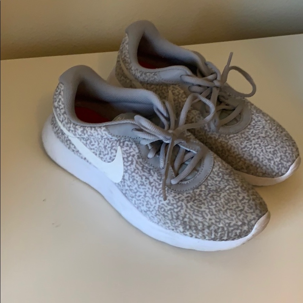 Grey Nike running shoes